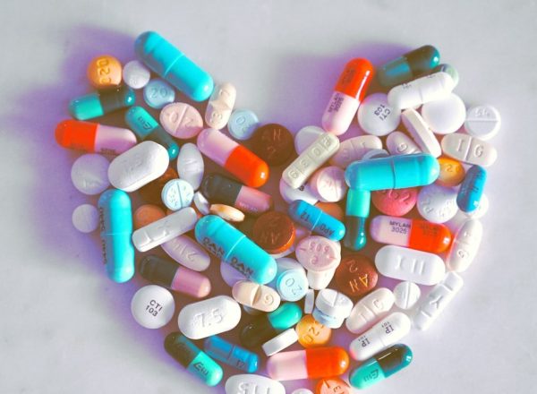 A compiled bunch of pills shaped into a heart, because art.